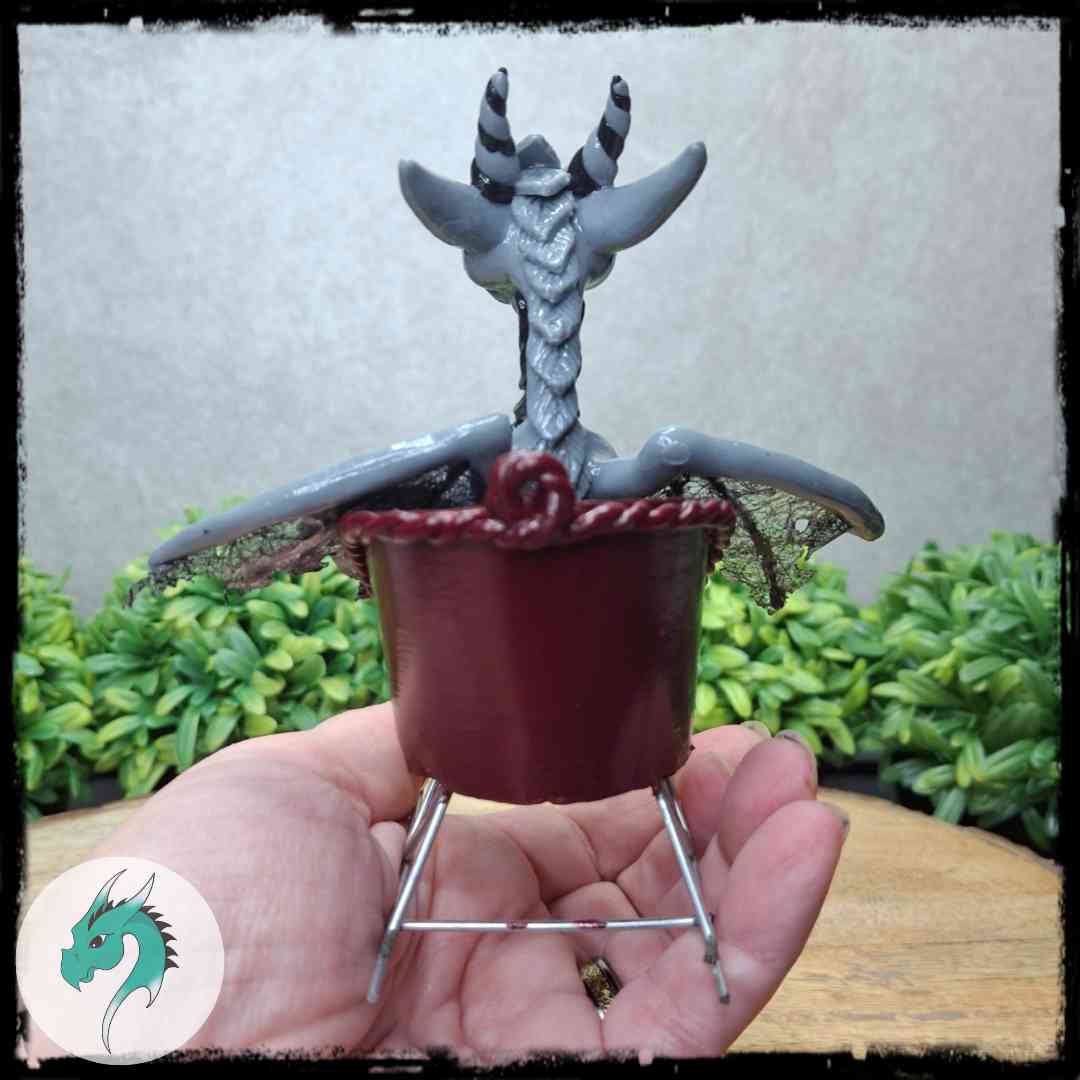 Back view of a clay dragon in a sleigh