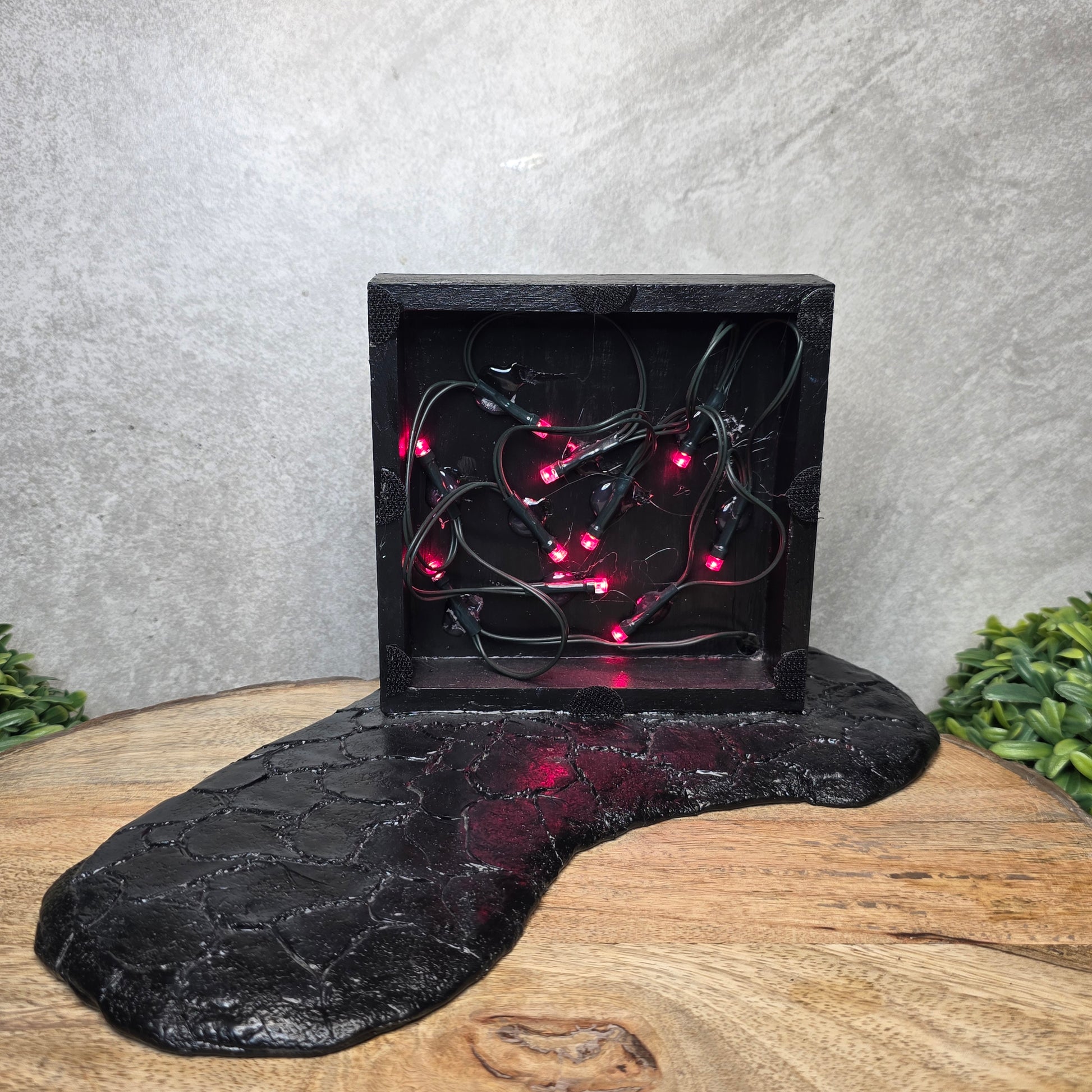 Inferno Room backdrop with front panel removed, showing string lights inside