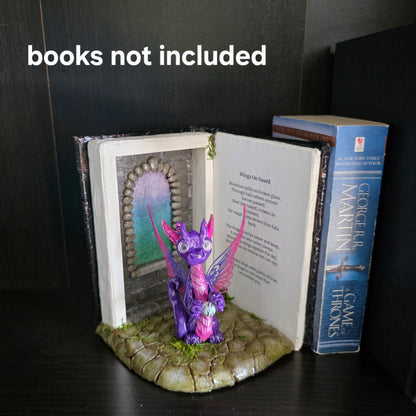 Book nook with fairy dragon on a bookshelf with text that says books not included