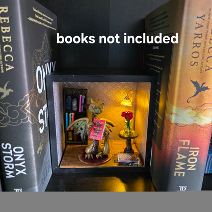 Book nook with dragon on bookshelf with text books not included