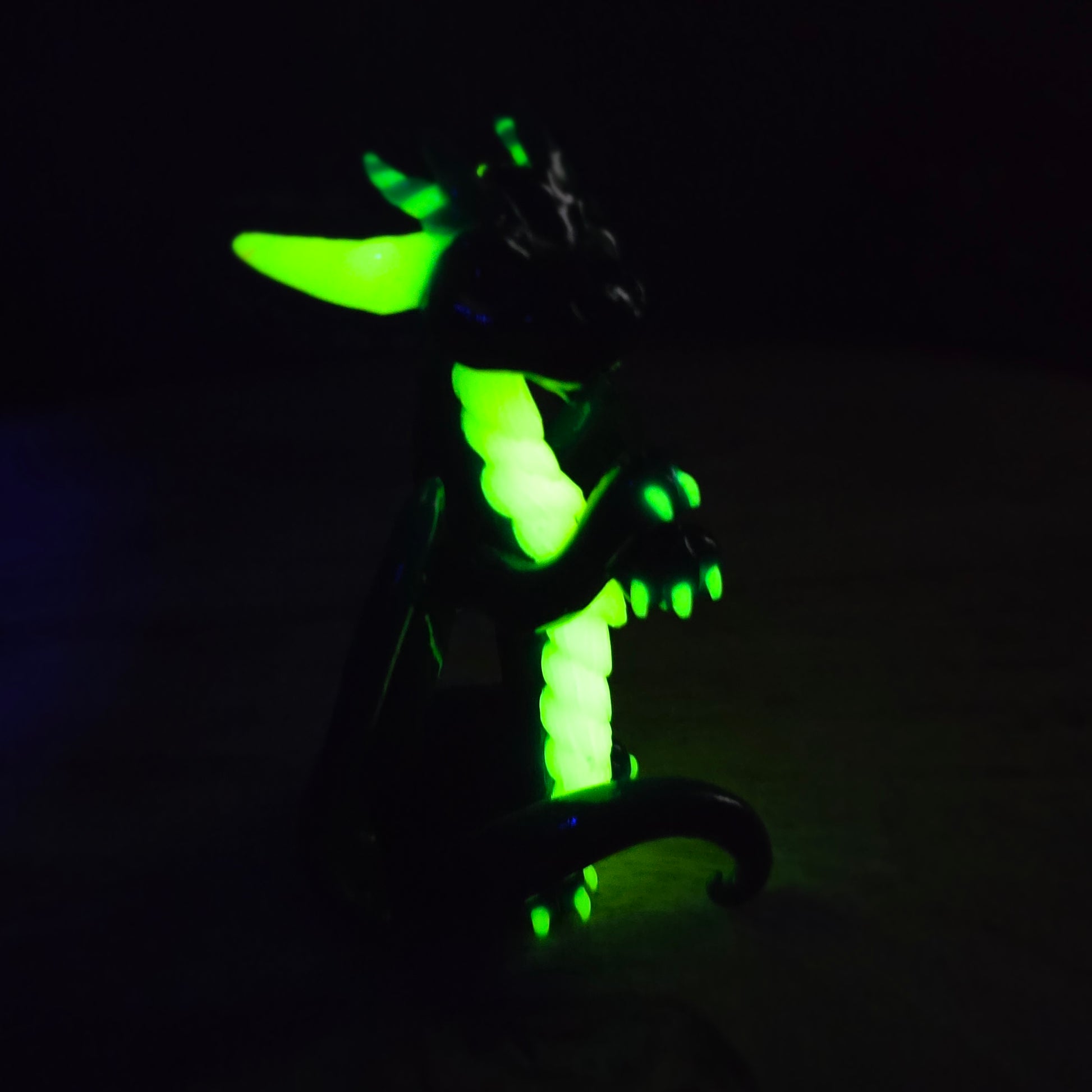 Glowing green dragon accents on a dark background
