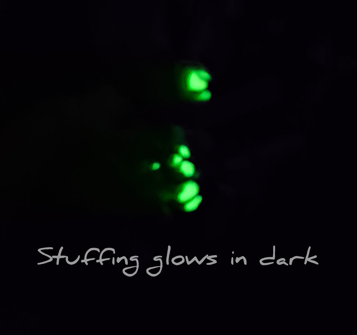 Stuffing from clay voodoo dragon glowing. Text says stuffing glows in dark