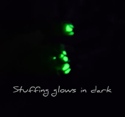 Stuffing from clay voodoo dragon glowing. Text says stuffing glows in dark