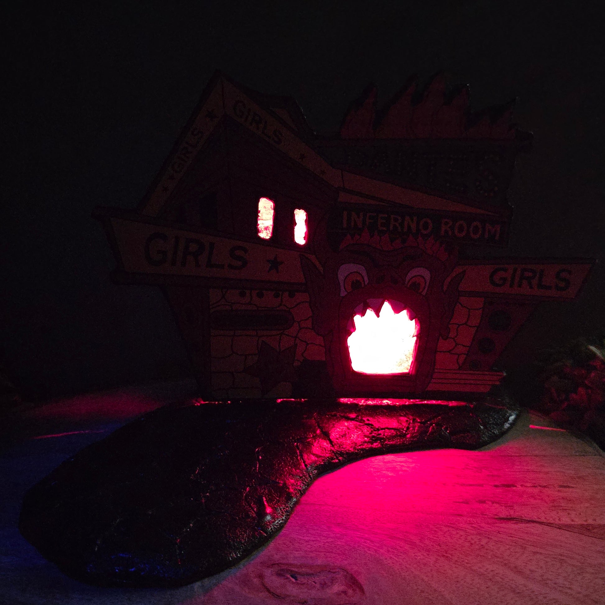 Inferno Room backdrop lit up in the dark