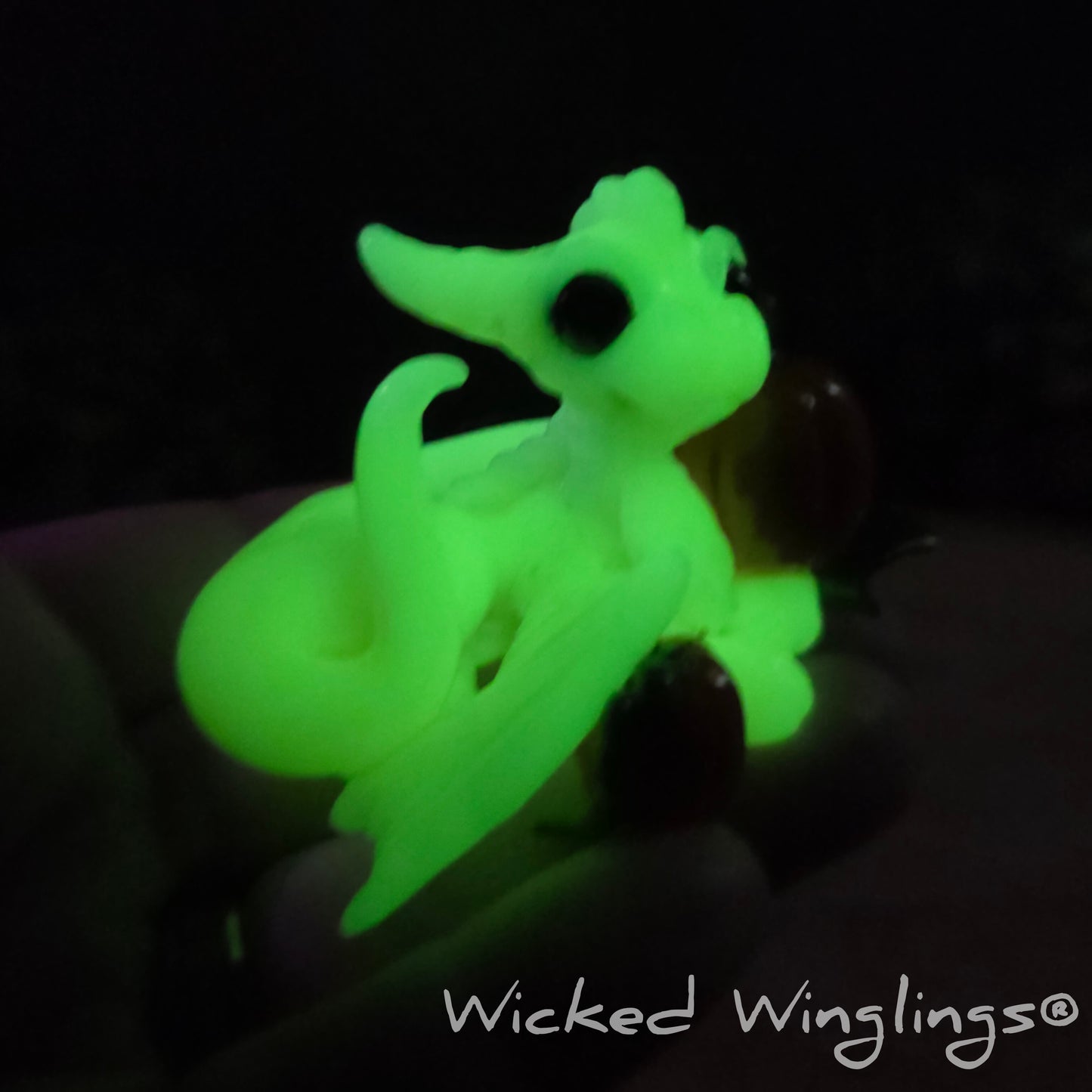 A glowing clay dragon sculpture