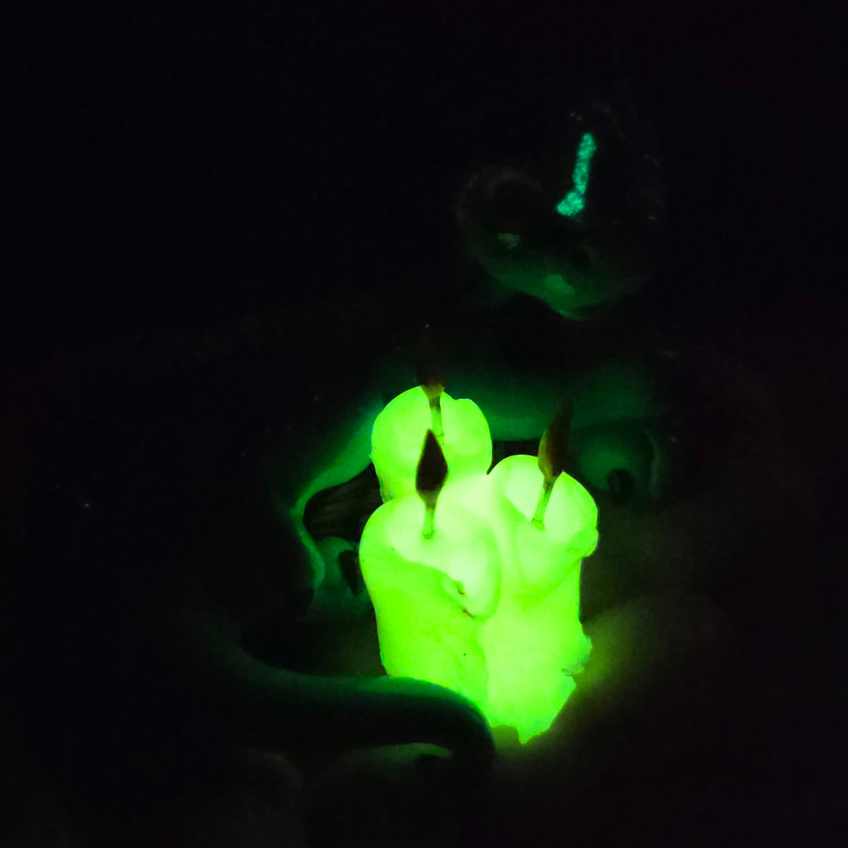 Clay candles glowing in dark