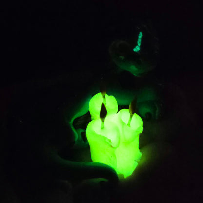 Clay candles glowing in dark